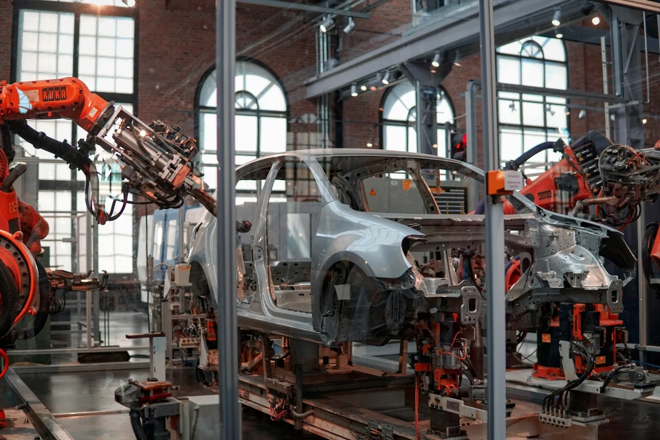 Illustration of car being built in a factory